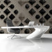 Office wall featuring subtle 3D diamond and circle patterned wallpaper.