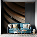 Modern living room featuring a curved bronze and charcoal abstract mural behind a sleek velvet sofa