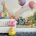 Whimsical safari train mural installed in a cozy gender-neutral nursery room.
