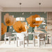 Creative home office wall decorated with hand-painted style botanical wallpaper in sage and ochre
