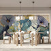 A contemporary meeting room with delicate morning glory mural wallpaper and gold hardware.