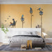 A light-filled reading nook featuring the birdhouse wall mural and a comfortable armchair.