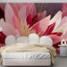 A modern bedroom space decorated with elegant abstract flower wallpaper in warm pink tones.