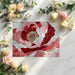 Artistic peony wallpaper design applied to a creative home office space with gold desk accessories