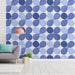 Cozy entryway wall decorated with a light blue repeating petal pattern