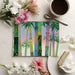 A sunny dining area with bamboo forest wallpaper, pairing vibrant colors with modern furniture.