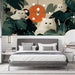 Modern bedroom featuring a playful cat and botanical mural behind a neutral headboard