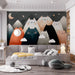 Cute mountain cat mural installed in a cozy bedroom with a wooden crib and neutral bedding.
