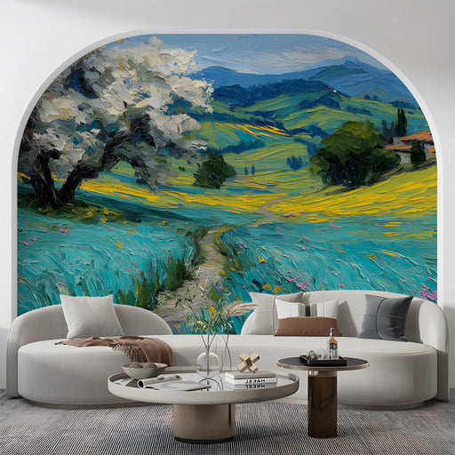 A cozy living room featuring the Tuscan meadow mural as a feature wall behind a beige linen sofa.