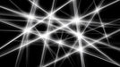 Abstract pattern of intersecting white light beams on a solid black background.