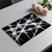 Stark monochromatic wallpaper featuring in a minimalist home office.