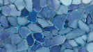 Abstract blue mosaic pattern featuring interlocking stone shapes in indigo, periwinkle, and bright cyan veins.