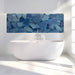 Contemporary bathroom decorated with a vibrant blue mosaic mural and minimalist light wood furniture.