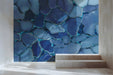 Modern entryway wall featuring a blue stone mosaic mural that adds a spa-like feel.
