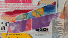 Abstract collage wallpaper design with torn paper textures, violet halftone strips, red typography, and an ochre sun motif.