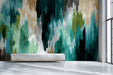 Living room interior featuring an abstract teal and sage brushstroke mural behind a modern sofa