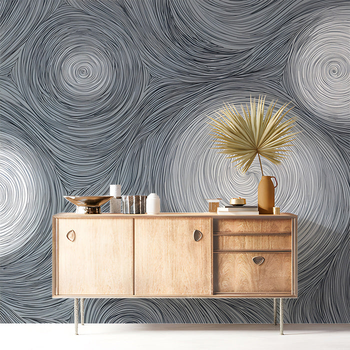 A sophisticated bedroom space showcasing a fluid gray swirl wallpaper design as an accent wall.