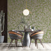 Sage floral wallpaper in a bright dining room