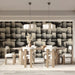 Modern home office with woven texture wall behind a walnut desk
