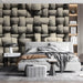 Bedroom interior featuring a woven basketry pattern accent wall behind a bed