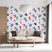 A  study with white linens and the soft blue floral mural creating a calm feature wall.