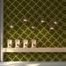 A refined shop interior featuring an olive green geometric wallpaper mural behind a headboard.