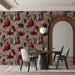 Close-up of a floral dining room wall featuring fuchsia flowers and muted heart motifs