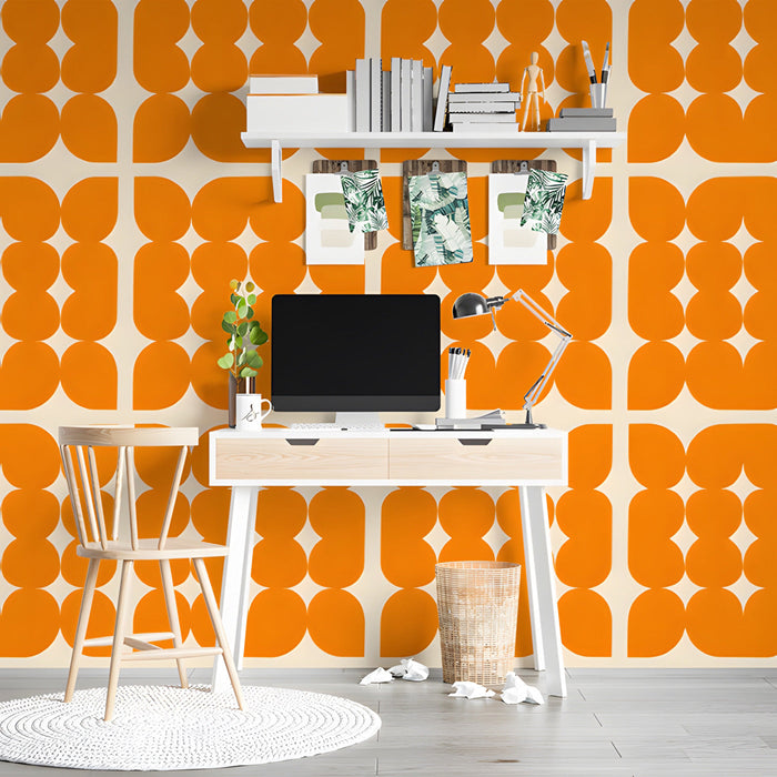 Mid-century modern study with a bold orange patterned accent wall.