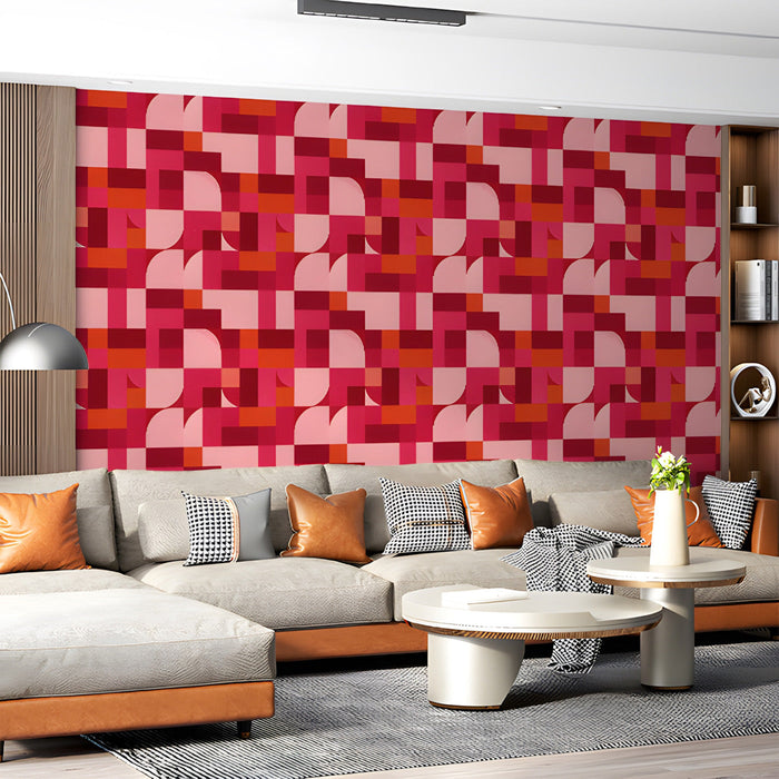 Geometric pink and red wallpaper behind a modern white living room set