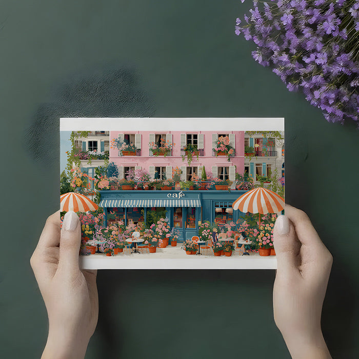 A whimsical cafe-themed girl's room featuring a floral French street scene wallpaper