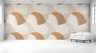 Modern hallway featuring a warm geometric wave mural on the sofa wall