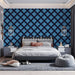 Bedroom wall featuring a modern blue geometric clover wallpaper pattern