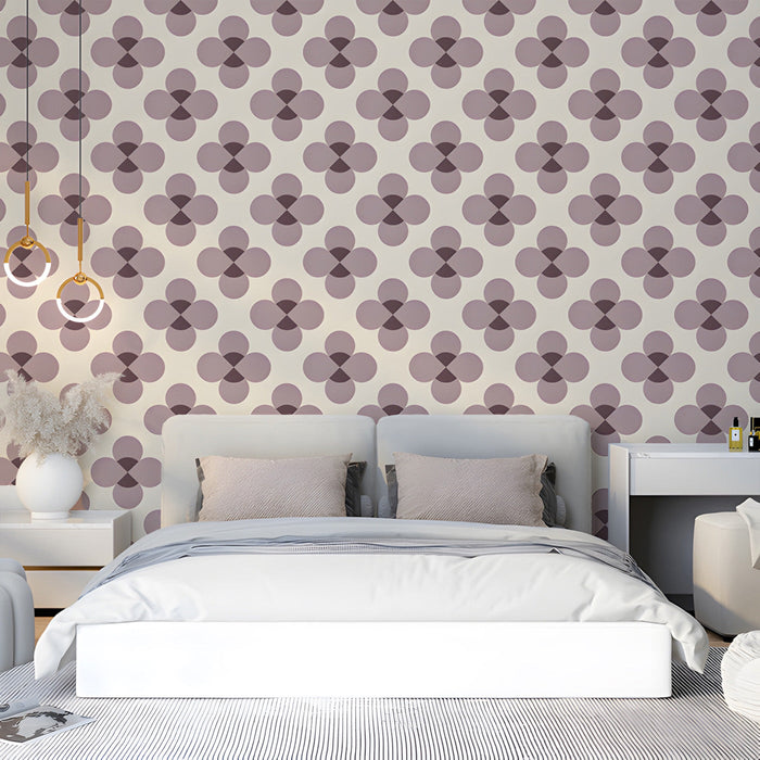 Repeating patterned wallpaper featured in a stylish, minimalist bedroom.