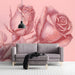 A feminine powder room decorated with a soft, etched botanical rose mural wallpaper.