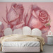 A romantic bedroom featuring a delicate rose line art mural behind a upholstered headboard.