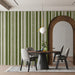 Sophisticated green and cream vertical stripe wall mural in a classic dining room setting