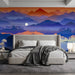 Bedroom interior with a serene mountain landscape mural behind a minimalist beige sofa and wooden coffee table.