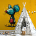 Whimsical illustration wallpaper acting as a focal point in a modern playroom