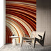 Contemporary home office wall with the flowing sienna line pattern behind a wooden desk setup.