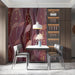 Crimson willow mural wallpaper installed in a moody and elegant dining room behind a headboard