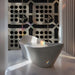 Contemporary bathroom installation of a neutral architectural grid mural