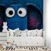 Whimsical elephant mural installed on a large feature wall in a colorful kid’s nursery