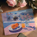 Scenic Greek island view mural featured in a sun-drenched kitchen with minimalist white cabinetry