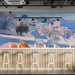 Santorini terrace wallpaper installed in a bright modern bar with light wood furniture