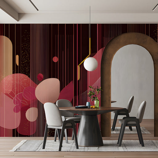 Modern dining room featuring a geometric burgundy mural wallpaper behind a velvet sofa