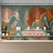 Light-filled dining area with a nature-inspired floral mural on the main wall