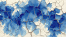 Abstract wallpaper featuring deep cobalt blue watercolor pools with a bone-white cracked earth texture overlay.