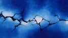Abstract wallpaper featuring vibrant cobalt blue and white watercolor clouds split by dark black jagged cracks.