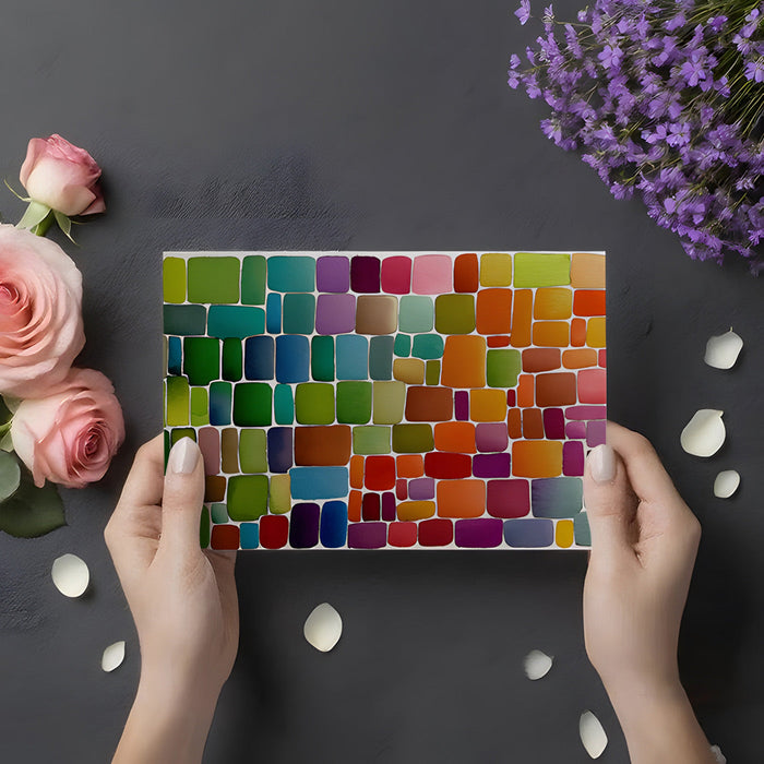 A modern dining room with a vibrant, hand-painted square pattern mural on the back wall.
