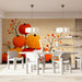 A cozy meeting featuring a seasonal autumn pumpkin wall mural behind a rustic wooden farmhouse table.